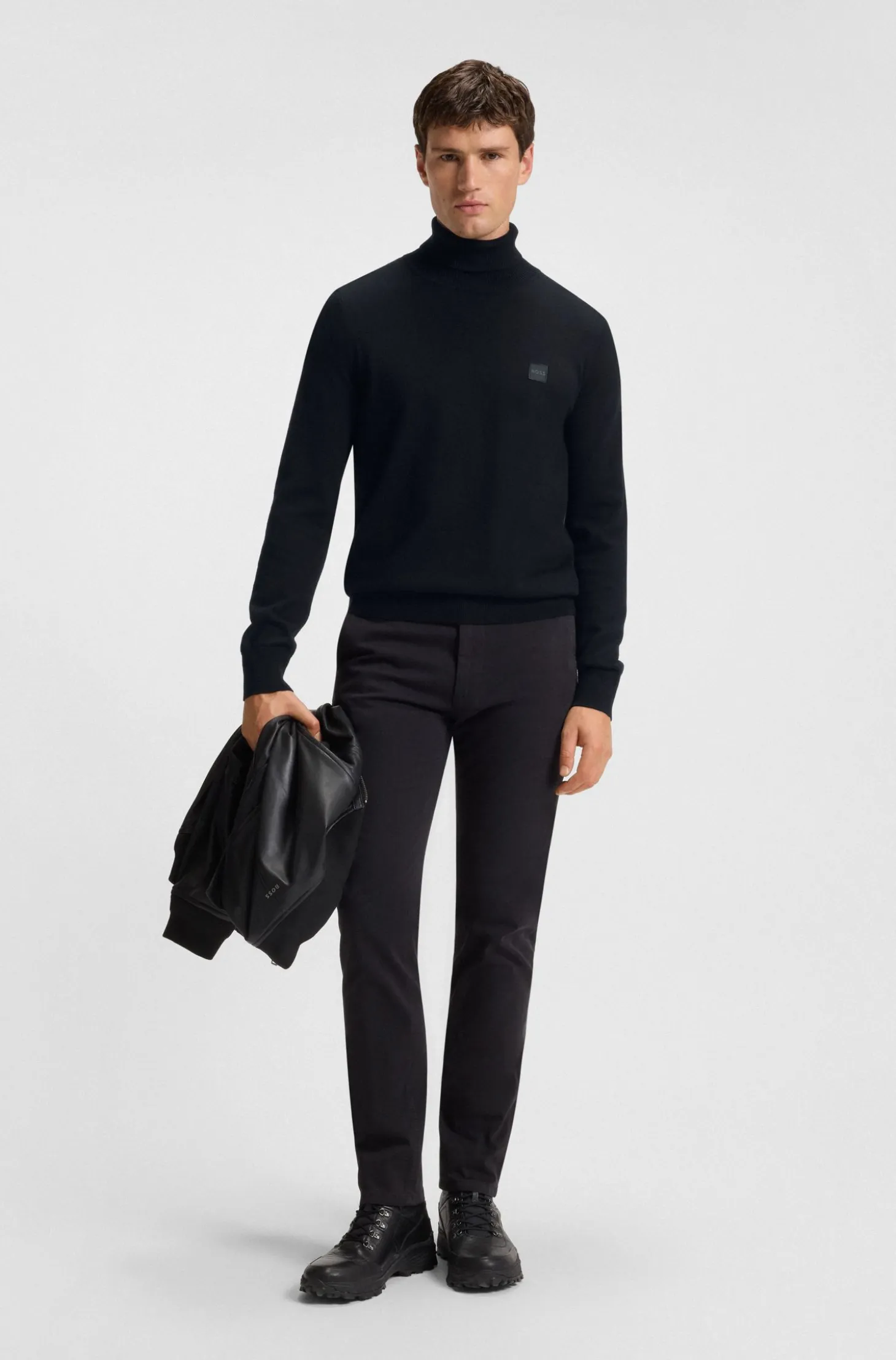 Rollneck sweater in cotton and cashmere with logo patch