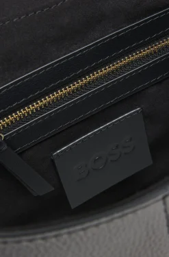 Shoulder bag in grained leather with logo plate