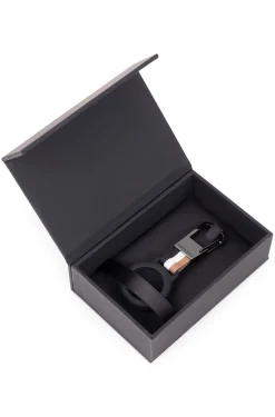 Signature-stripe key ring with AirTag holder