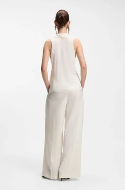 Sleeveless blouse in sandwashed silk with V neckline