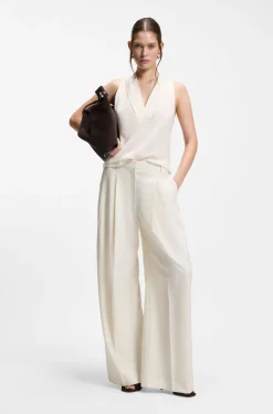 Sleeveless blouse in sandwashed silk with V neckline
