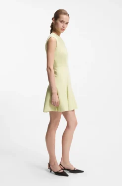 Sleeveless dress with gold-tone flower brooch