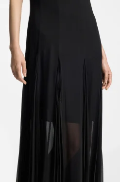 Sleeveless dress with plissé skirt inserts