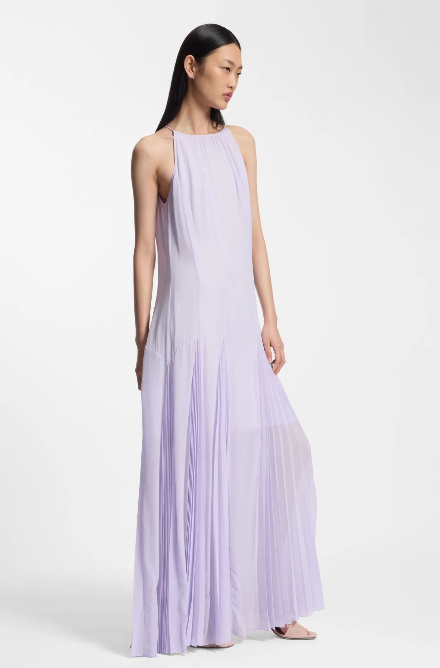 Sleeveless dress with plissé skirt inserts