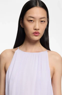 Sleeveless dress with plissé skirt inserts