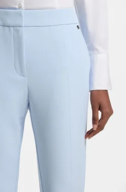 Slim-fit trousers in stretch fabric with logo rivet
