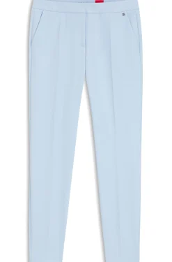 Slim-fit trousers in stretch fabric with logo rivet