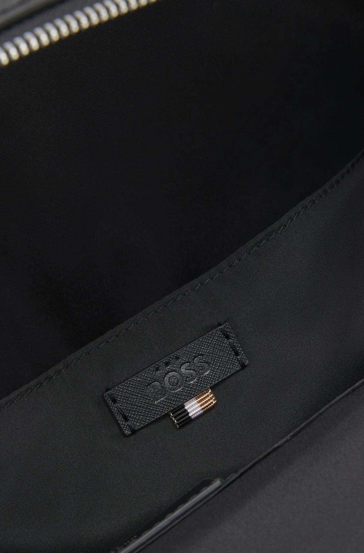 Structured backpack with polished logo lettering