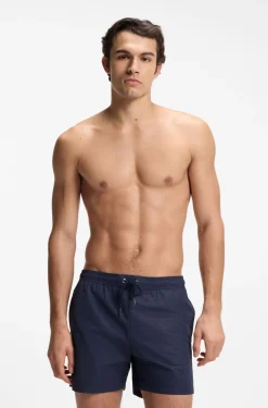 Swim shorts with all-over monogram print