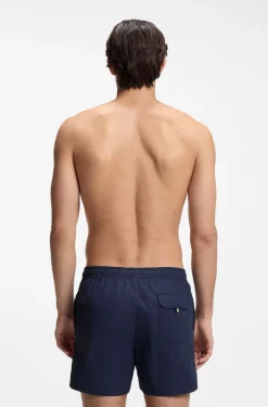 Swim shorts with all-over monogram print