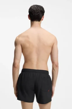 Swim shorts with repeat logos