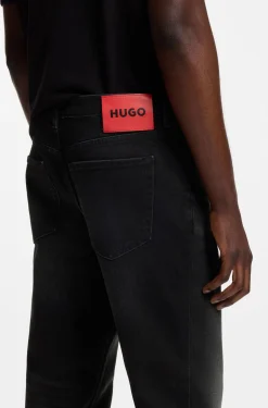 Tapered-fit jeans in black stretch denim