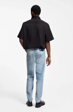 Tapered-fit jeans in light-blue distressed denim