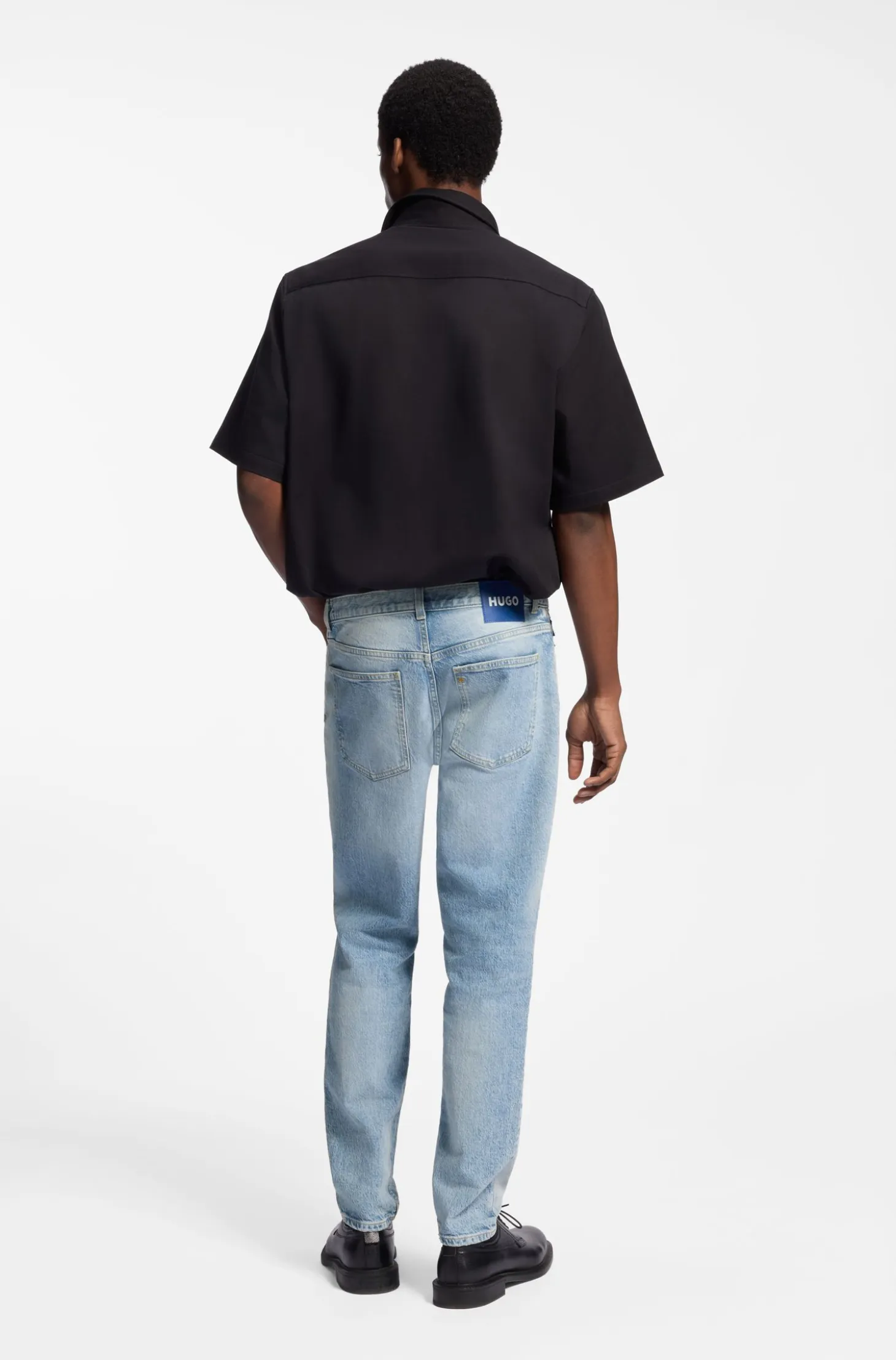 Tapered-fit jeans in light-blue distressed denim