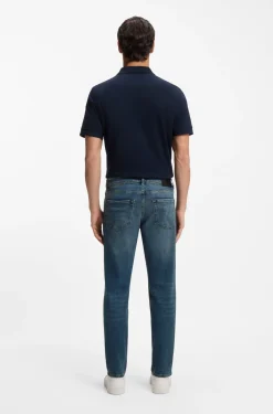 Tapered-fit jeans in washed-blue stretch denim