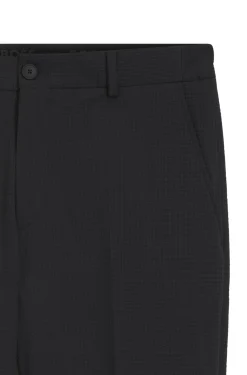 Tapered-fit trousers in stretch seersucker