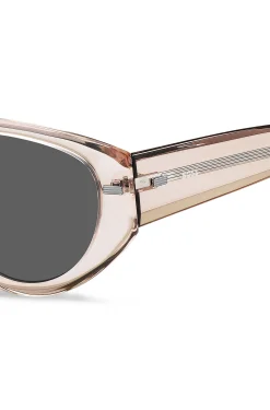Translucent pink bio-acetate sunglasses with patterned rivets