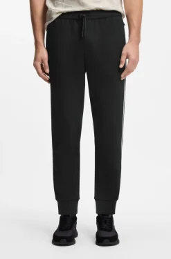 Triangle-jacquard tracksuit bottoms with rubberised logo