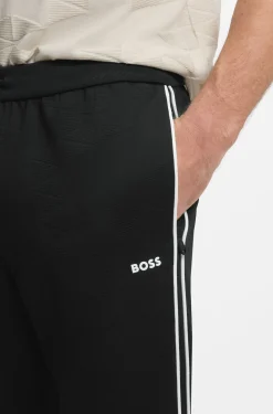 Triangle-jacquard tracksuit bottoms with rubberised logo