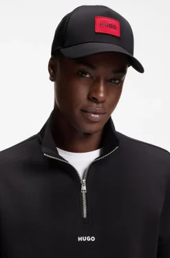 Twill trucker cap with red logo label