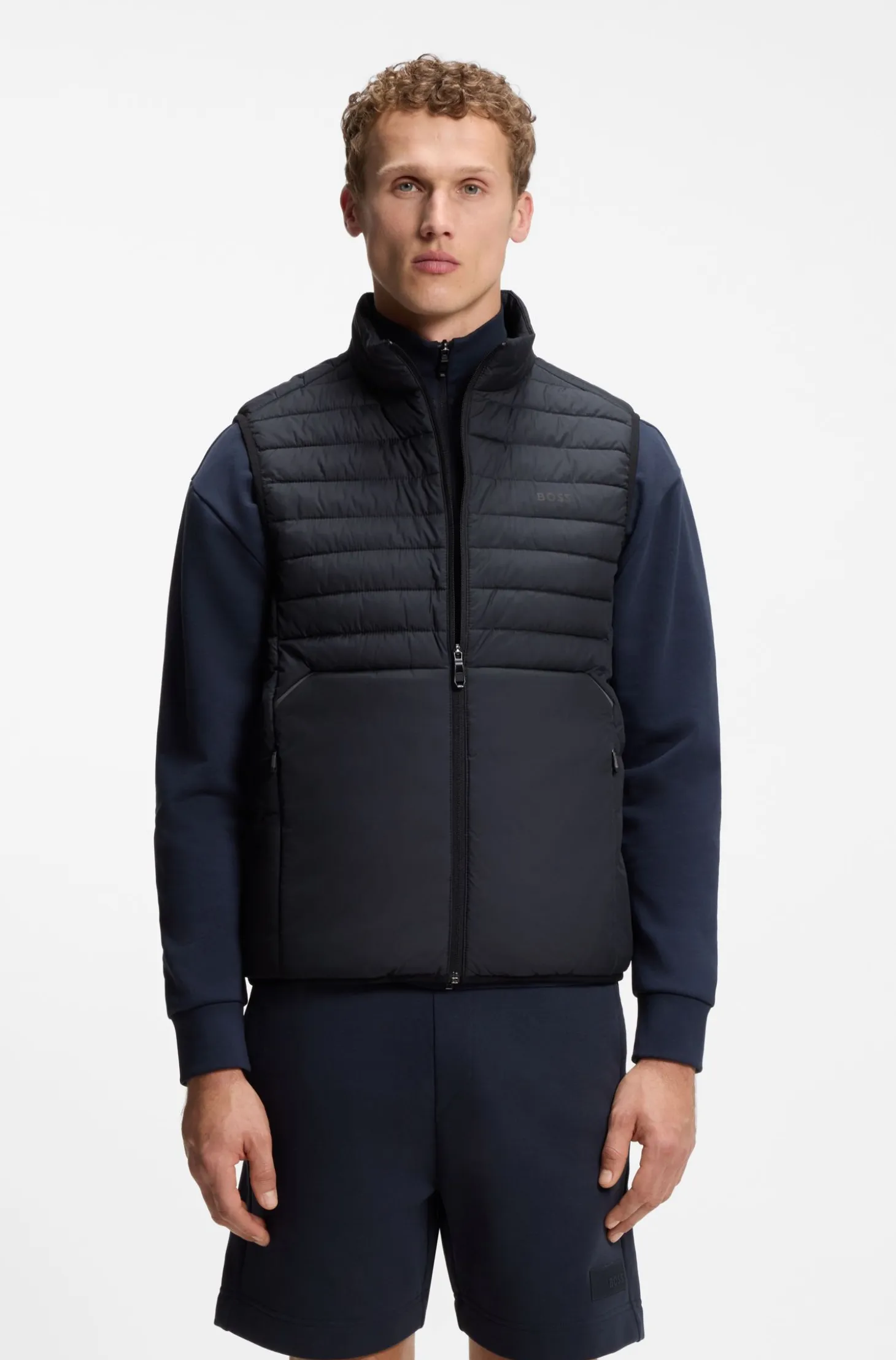 Water-repellent gilet with decorative reflective accents