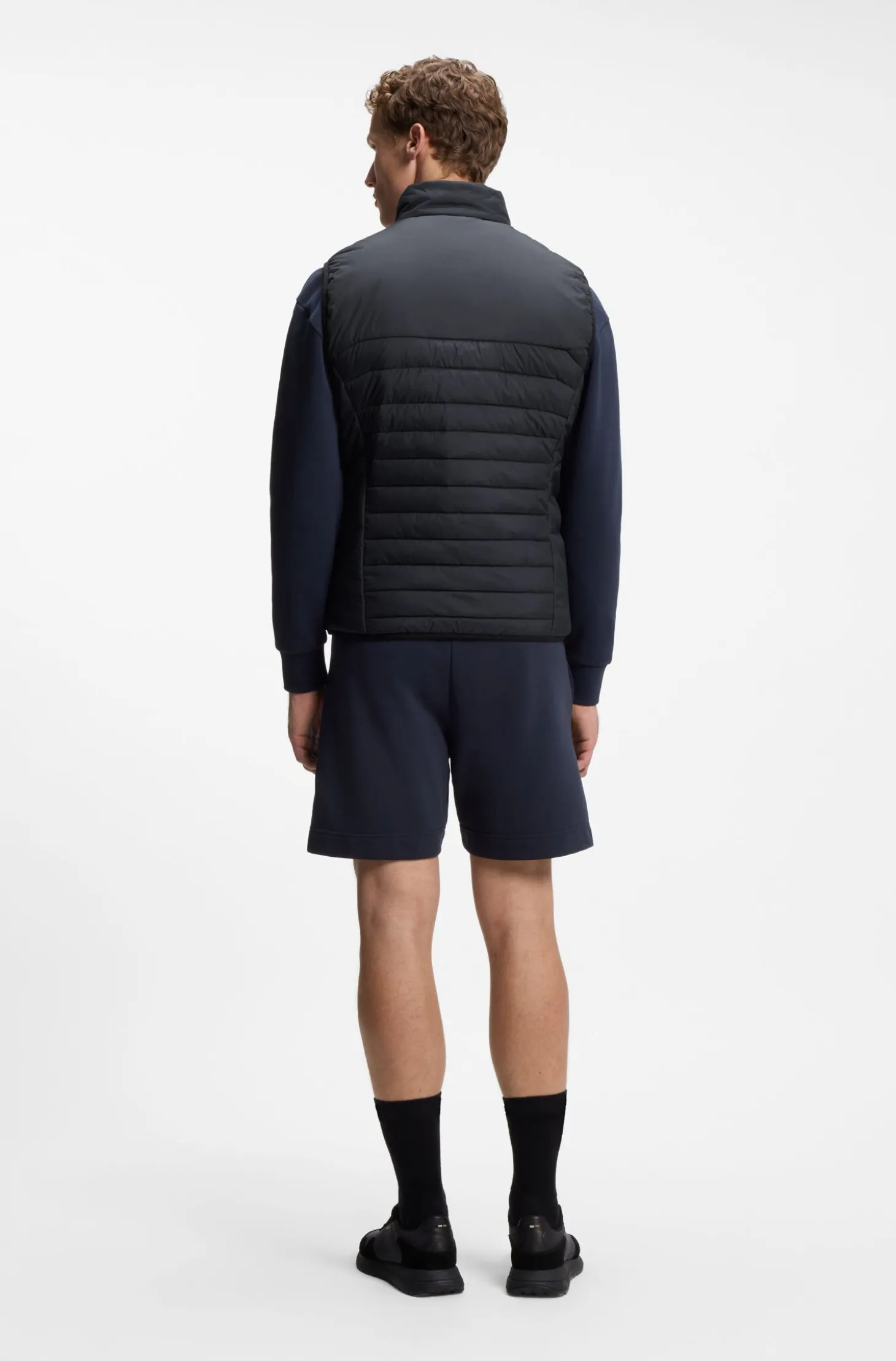 Water-repellent gilet with decorative reflective accents