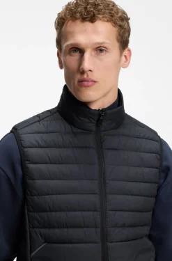 Water-repellent gilet with decorative reflective accents