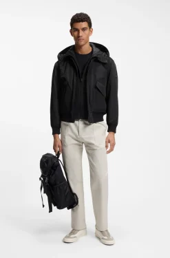 Water-repellent jacket with detachable hooded bib