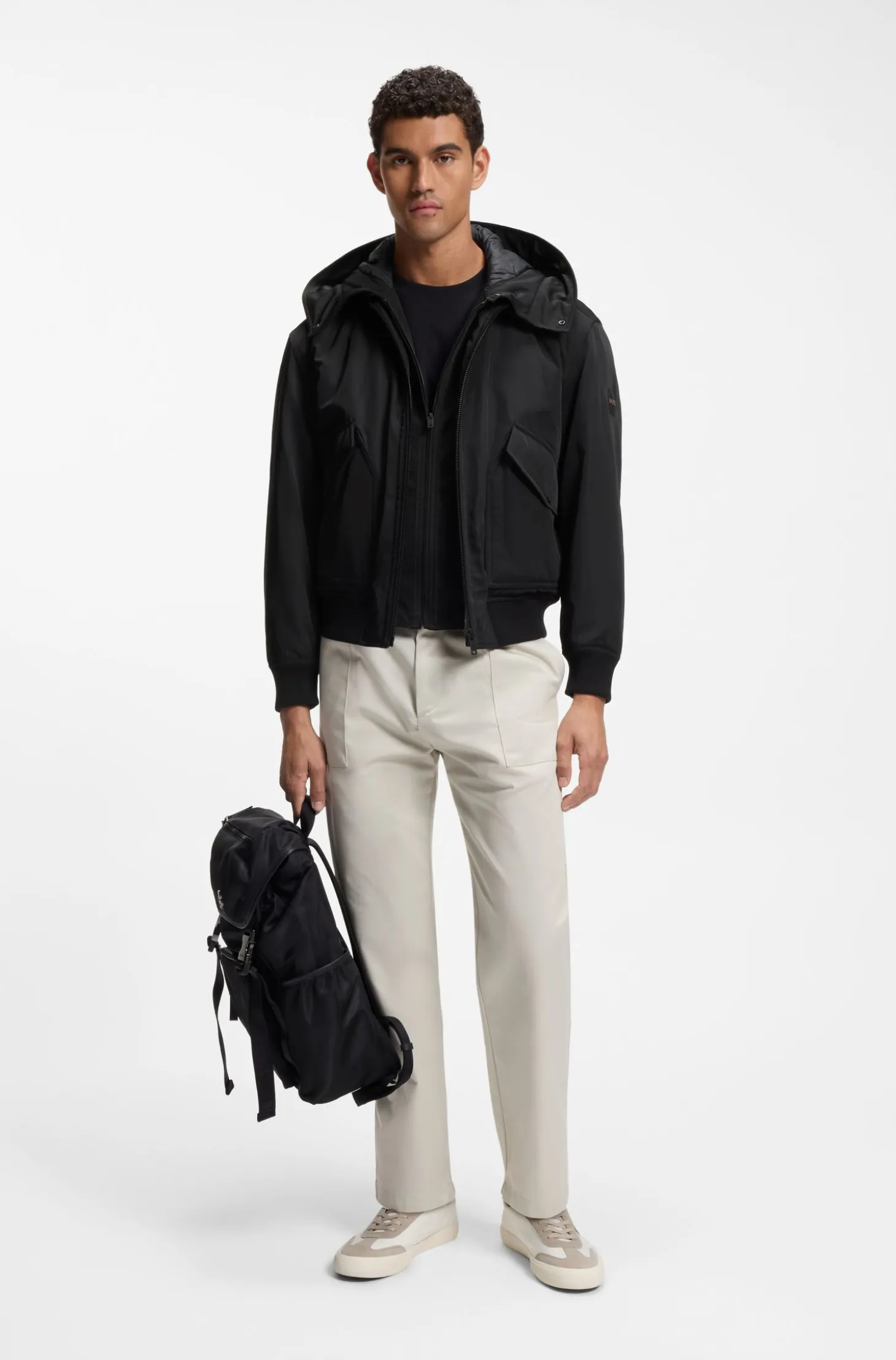 Water-repellent jacket with detachable hooded bib