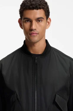 Water-repellent jacket with detachable hooded bib