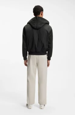 Water-repellent jacket with detachable hooded bib