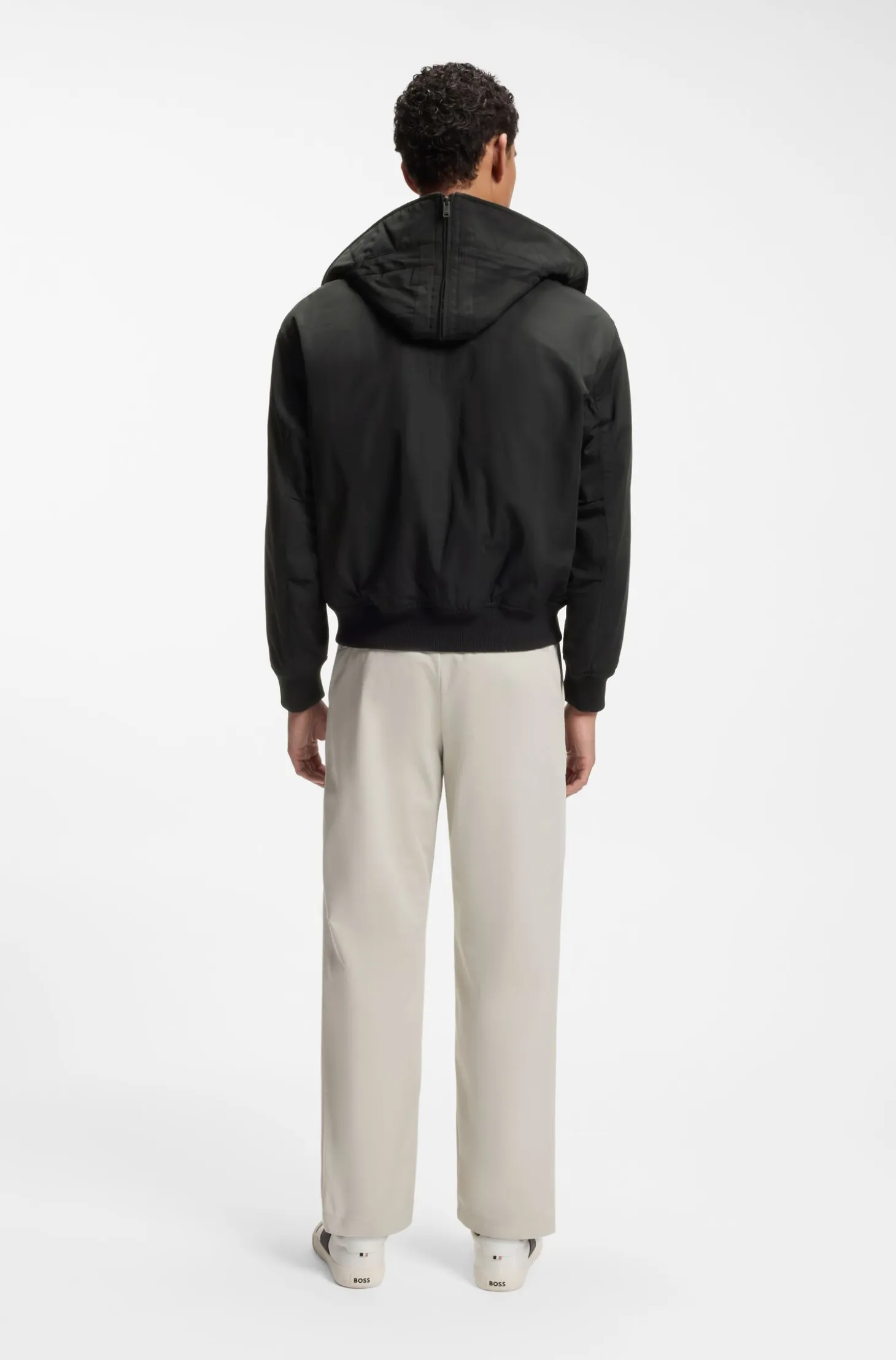 Water-repellent jacket with detachable hooded bib