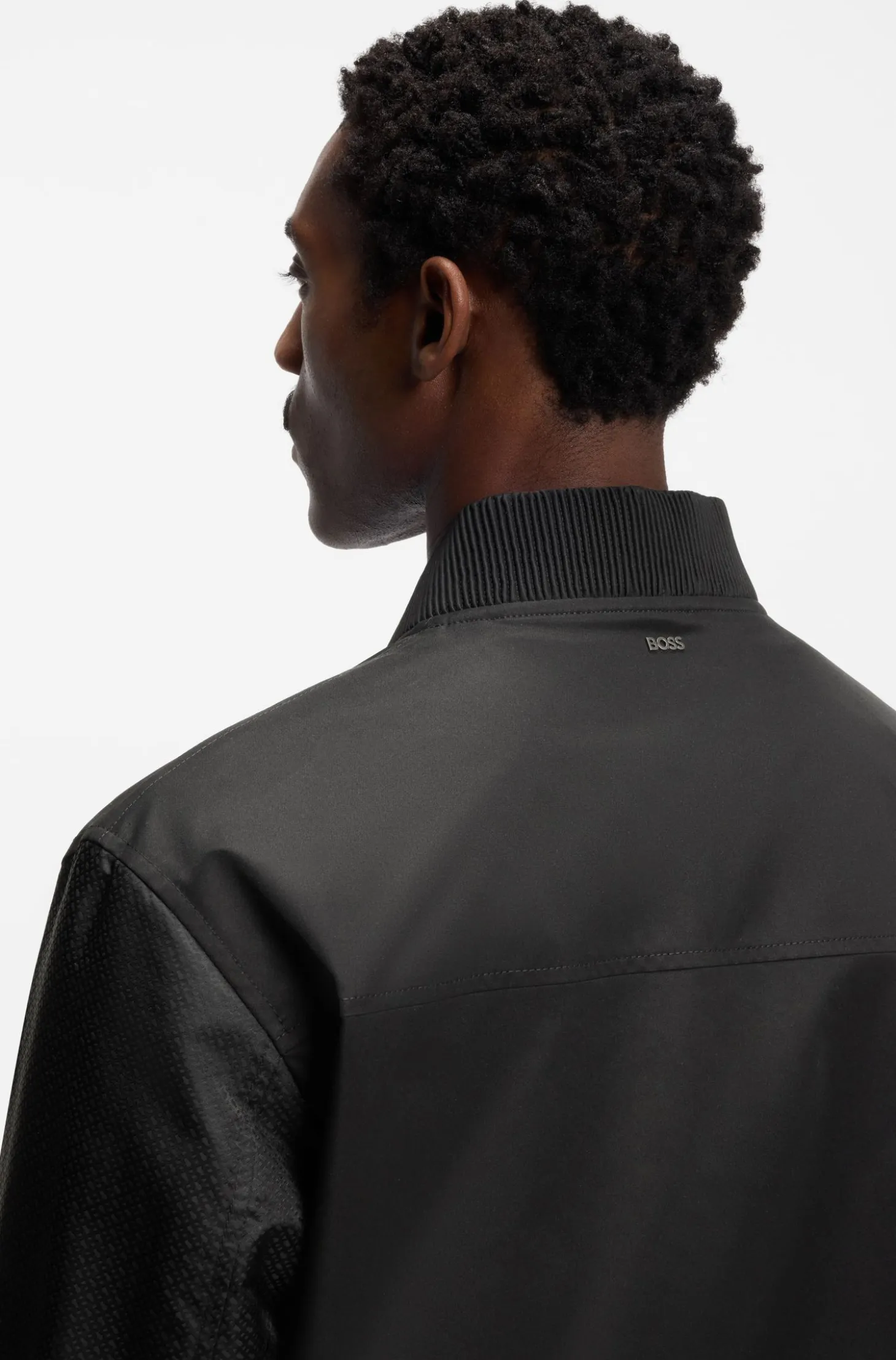 Water-repellent jacket with monogram-pattern sleeves