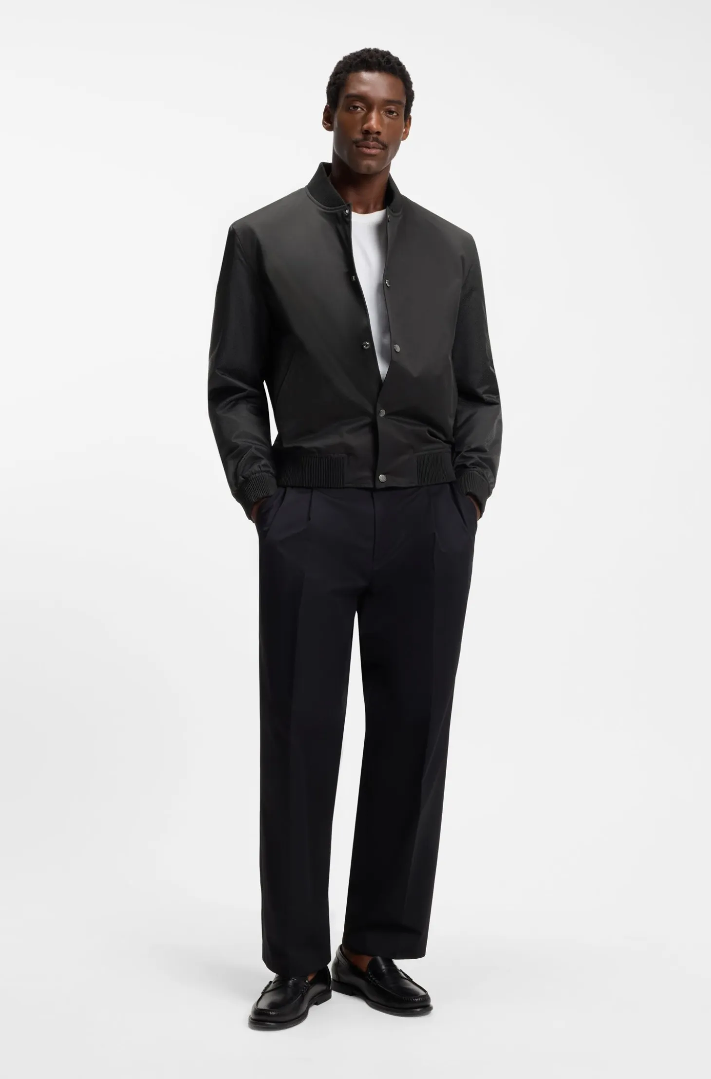 Water-repellent jacket with monogram-pattern sleeves