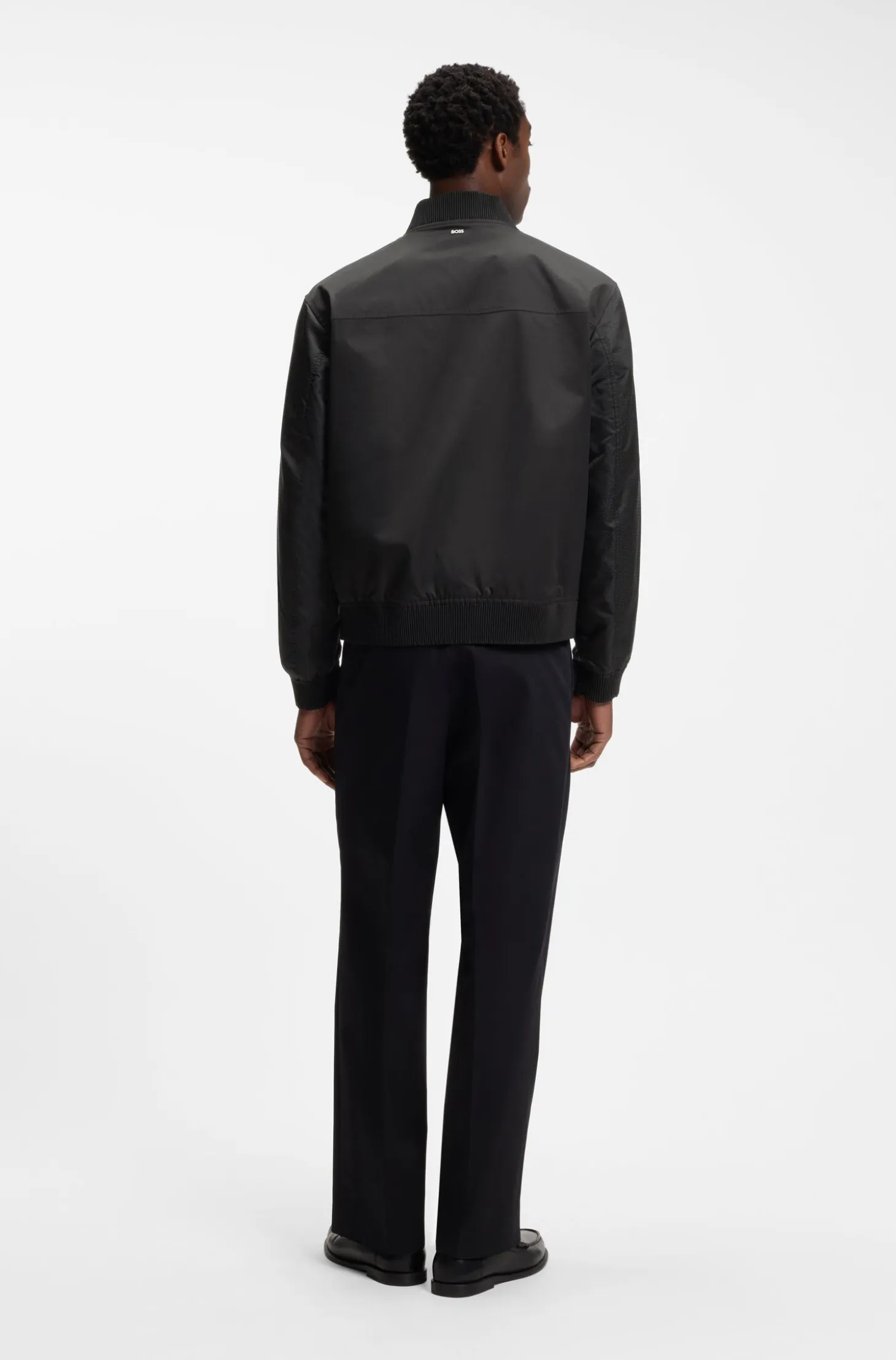 Water-repellent jacket with monogram-pattern sleeves