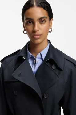 Water-repellent trench coat with buckled belt