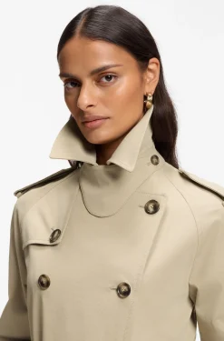 Water-repellent trench coat with buckled belt