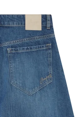 Wide-leg high-rise jeans in vintage-wash denim