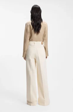 Wide-leg jeans in cream denim with front crease