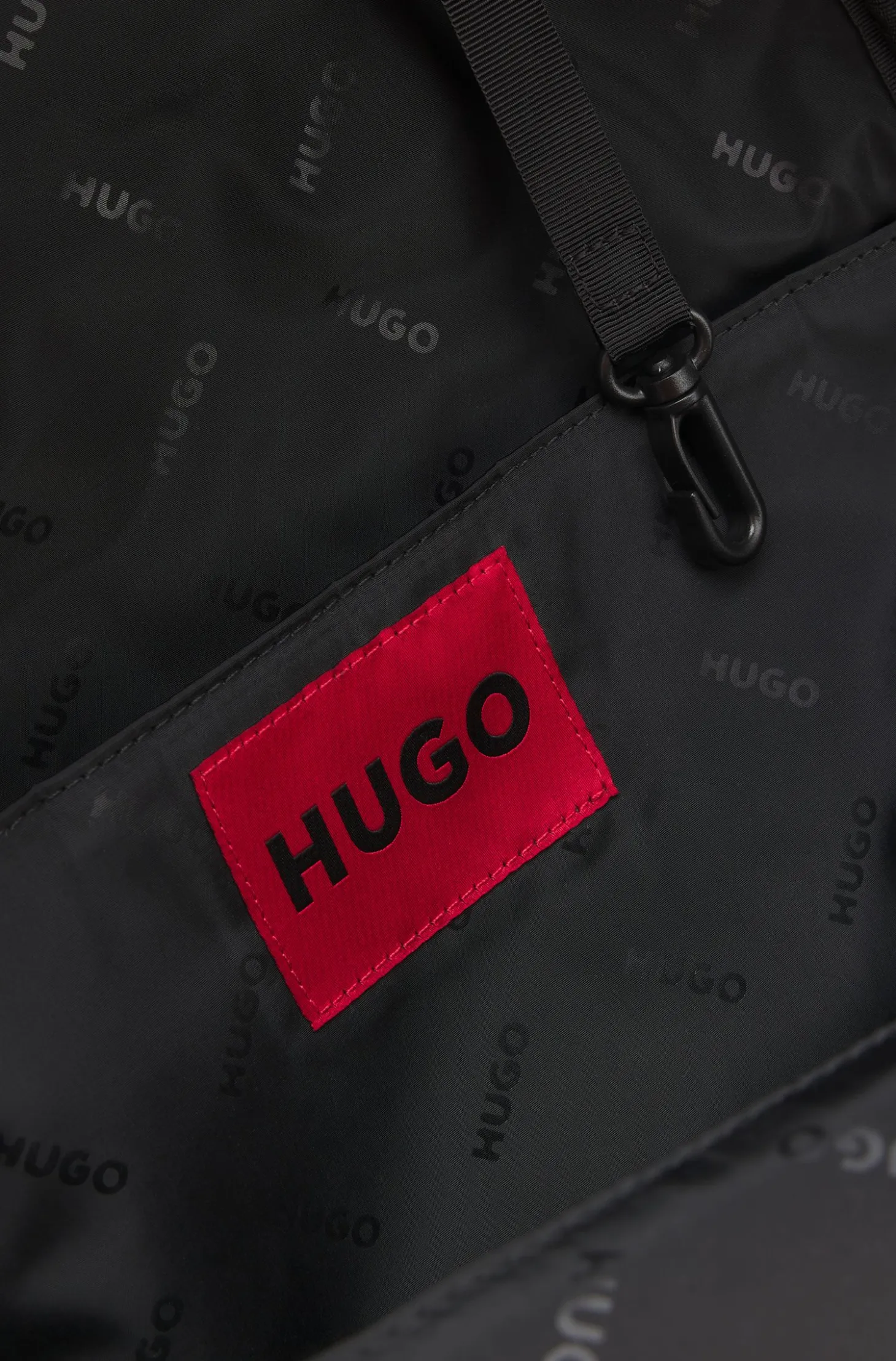 Zipped backpack with rubber logo patch