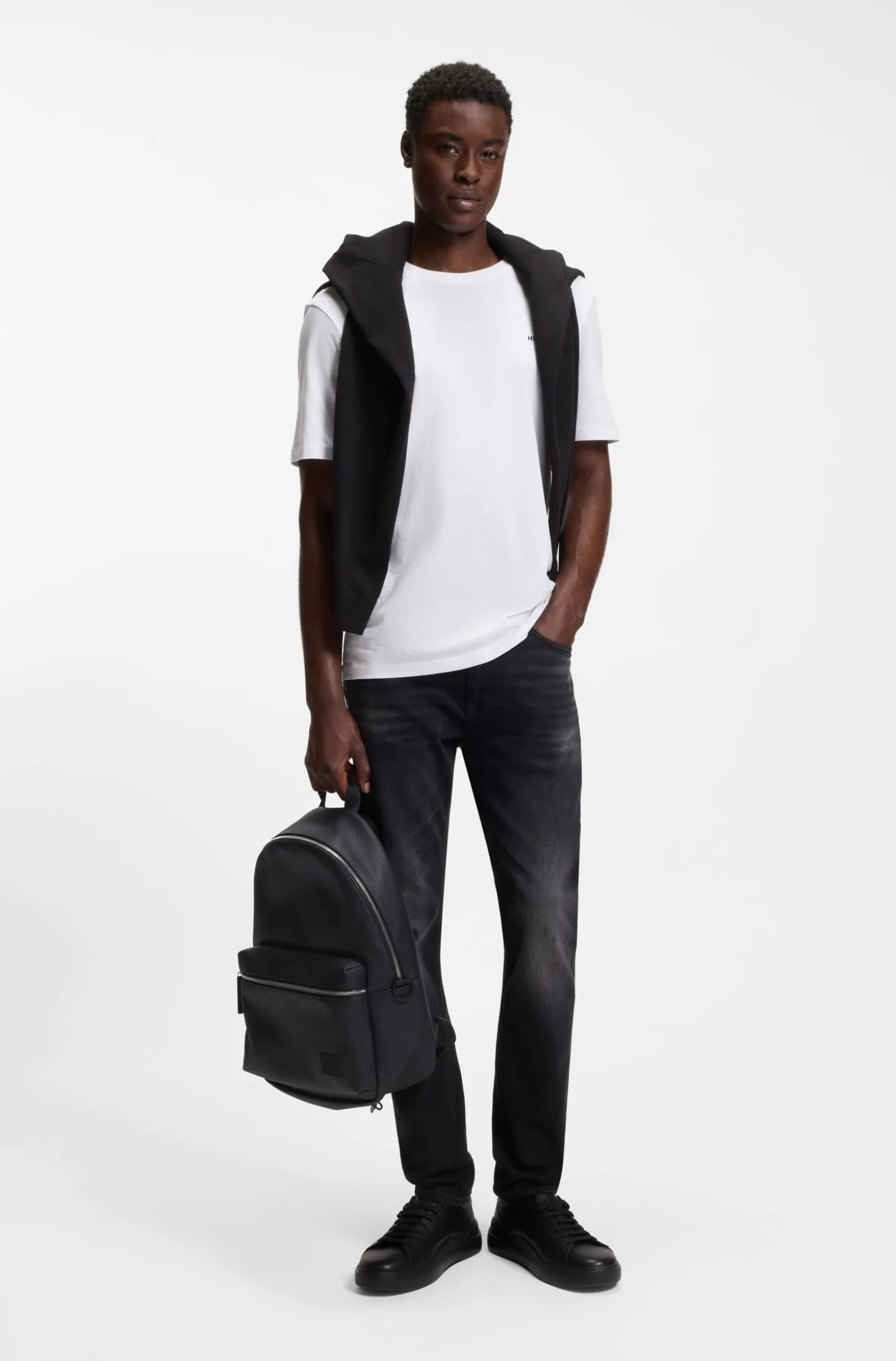 Zipped backpack with rubber logo patch
